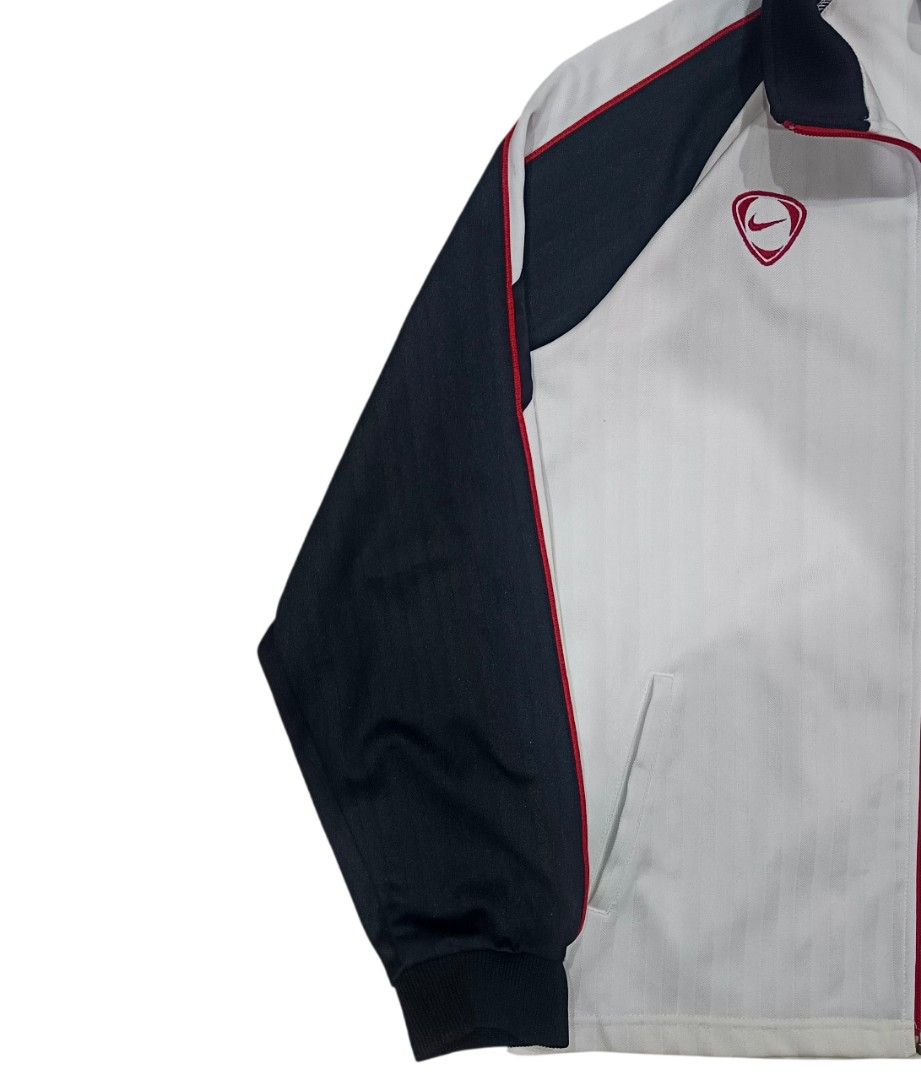 Nike Track Jacket - White and Black (Category: Coats, Jackets and Outerwear) located in General Santos City (Dadiangas). Submitted by _jackeith (Listing ID 1432701006, Image 2). Description: - Nike track jacket - Color: White, black, and red accents - Size: Medium - Features: Full zip closure, side pockets, Nike logo on chest and back - Japanese text on inside tag - Condition: No Issue - Dimes: 24L x 20W.