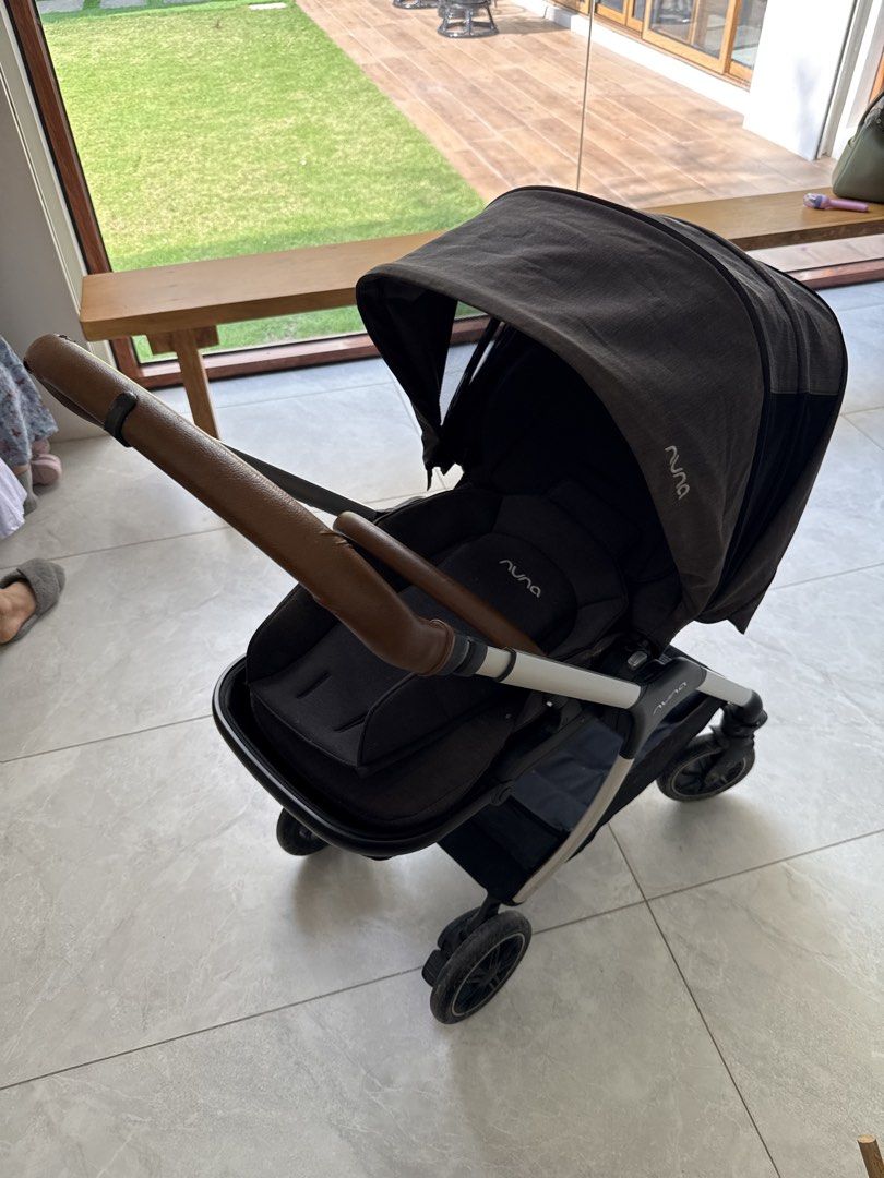 Nuna MIXX Stroller (Category: Strollers) located in Quezon City. Submitted by martinhatol (Listing ID 1432602304, Image 1). Description: - Nuna MIXX stroller - Dark grey canopy - Black seat - Brown leather handle - Four wheels - Sleek design - Well-padded seat - Good working condition No other issues other than some wear on the leather handle. .