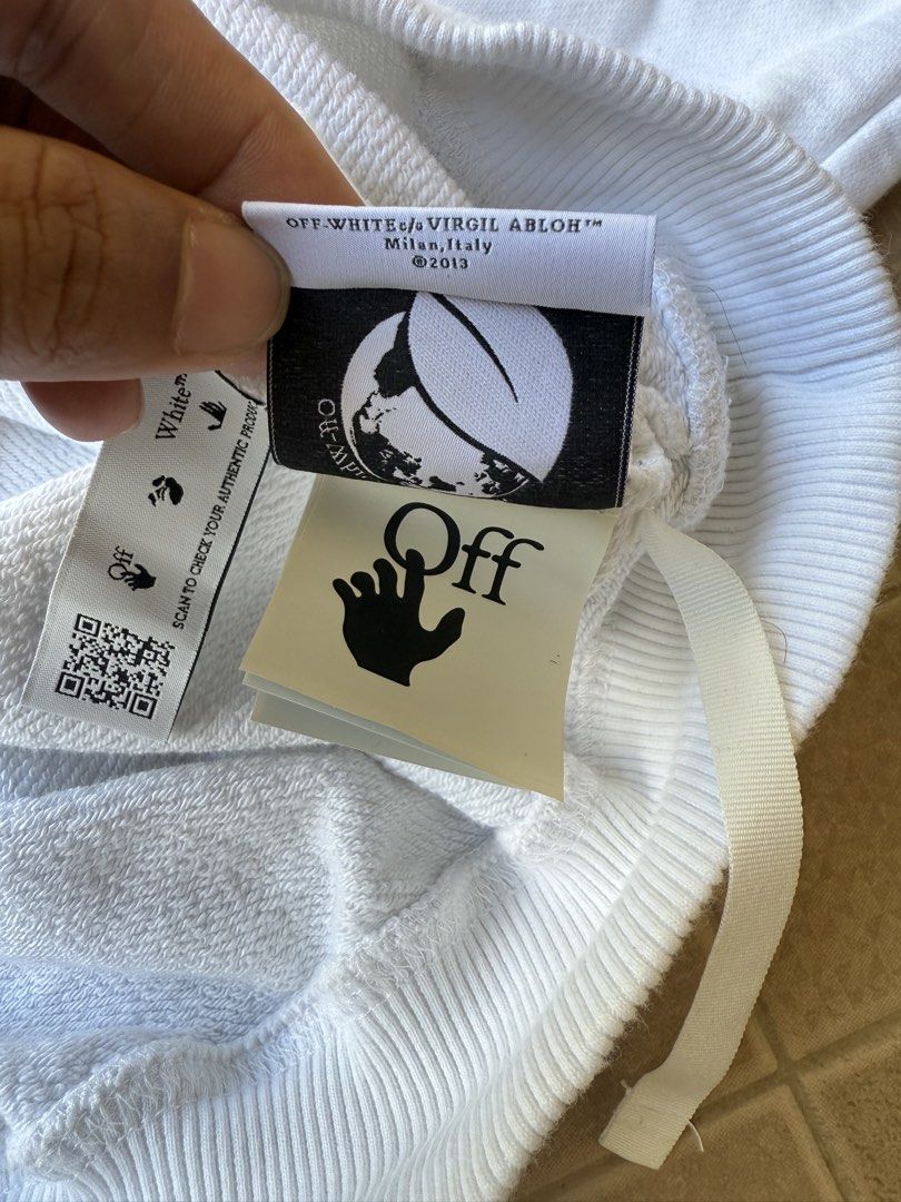Off-White White Hoodie (Category: Hoodies) located in Legazpi City. Submitted by tiny0509 (Listing ID 1432661159, Image 3). Description: - Off-White hoodie - Graphic design on front - Features Off-White logo - Includes "FOR THE NATURE" tag - Made in Milan, Italy, 2013 - Drawstring hood - Ribbed cuffs and hem -23x29 dimes excellent to new no issues.
