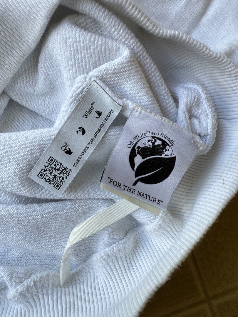 Off-White White Hoodie (Category: Hoodies) located in Legazpi City. Submitted by tiny0509 (Listing ID 1432661159, Image 2). Description: - Off-White hoodie - Graphic design on front - Features Off-White logo - Includes "FOR THE NATURE" tag - Made in Milan, Italy, 2013 - Drawstring hood - Ribbed cuffs and hem -23x29 dimes excellent to new no issues.