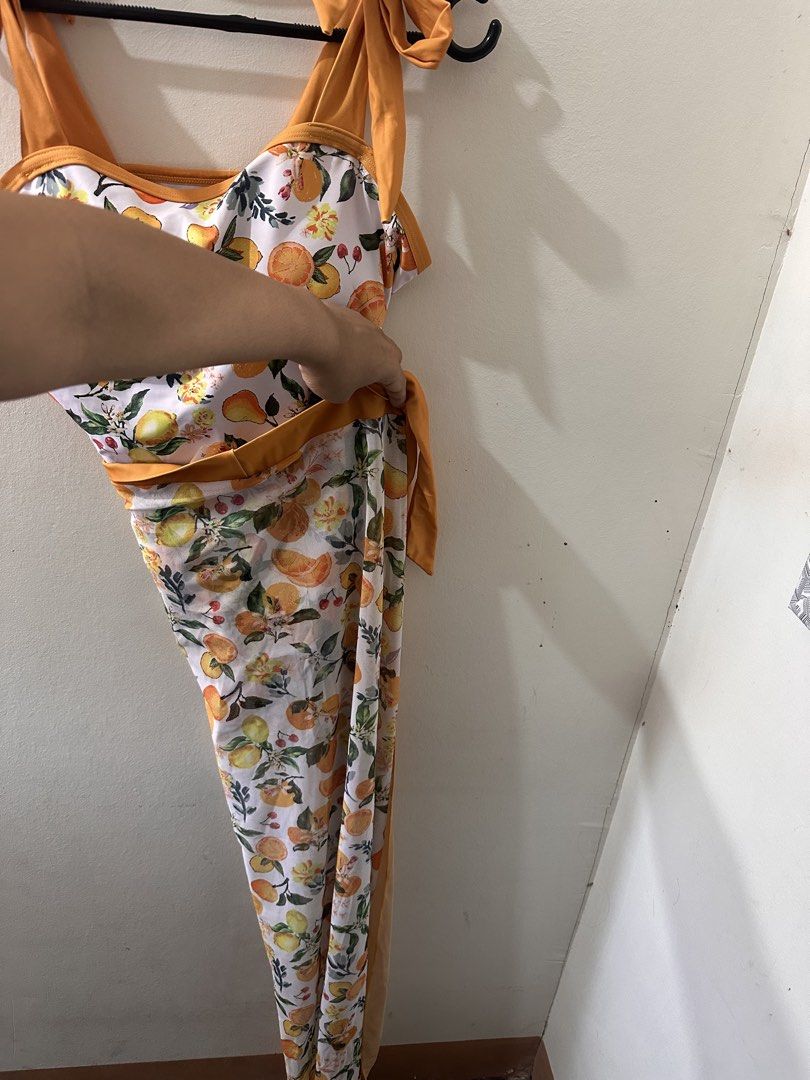 Orange Print Swimsuit with Tie Straps (Category: Bikinis & Swimsuits) located in Manila. Submitted by readysellgo (Listing ID 1432789182, Image 2). Description: Fits L-XL. It has tie straps and a flattering design. The swimsuit comes with a matching cover-up. .