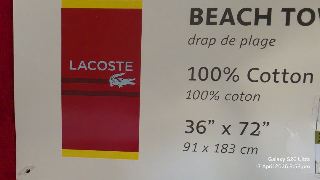 Original Lacoste Beach Towel 36" x 72" (Category: Bedding & Towels) located in Carmona. Submitted by Asimplehappinesstore (Listing ID 1432677757, Image 3). Description: - Brand new Lacoste beach towel - Made of 100% cotton - Features the Lacoste logo - Eye-catching red and yellow design - Generous size: 36" x 72" (91 x 183 cm) - Ideal for beach and pool use - Never been used.