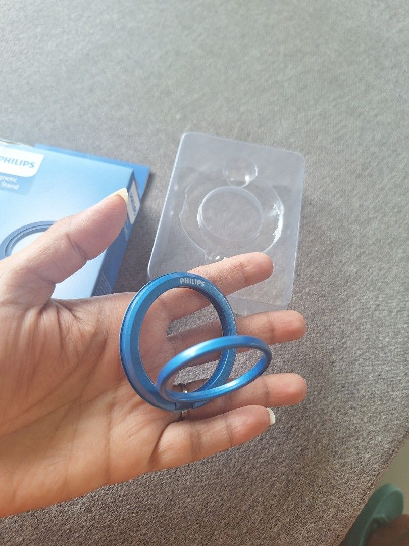Philips Magnetic Ring Stand (Category: Mounts & Holders) located in Quezon City. Submitted by andycandy2011 (Listing ID 1432641574, Image 2). Description: - Philips magnetic ring stand - 360degree rotation and 180degree flip - Strong magnetic hold - Foldable design - Made of metal - Brand new - Comes in original packaging.