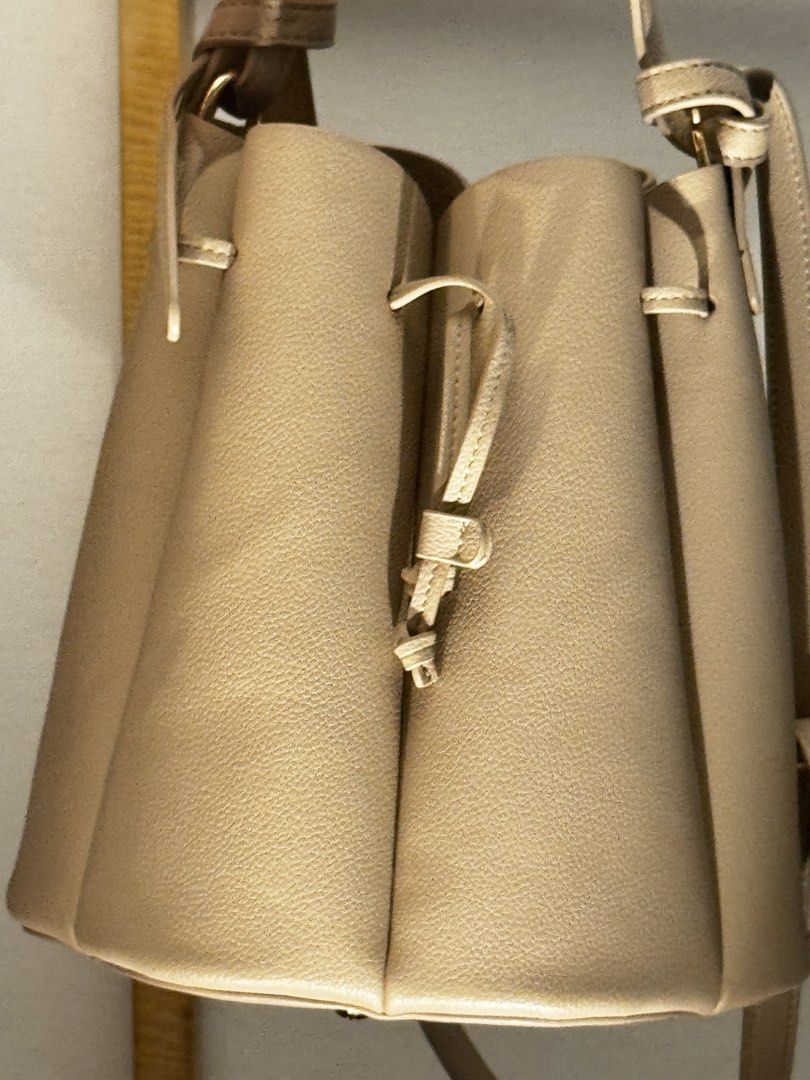 Polène Numero Sept Handbag (Category: Luxury Bags & Wallets) located in Makati City. Submitted by sustanableliving (Listing ID 1432615856, Image 2). Description: - Polène Numero Sept handbag - Neutral color - Drawstring closure - Shoulder strap - Unique, structured design - Includes dust bag - Made of textured material.