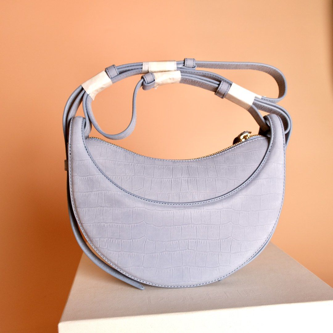 Polène Numéro Dix Edition Crocodile Nubuck Polar (Category: Luxury Bags & Wallets) located in Quezon City. Submitted by annasprieto (Listing ID 1432642475, Image 3). Description: - Polène Numéro Dix handbag - Stylish crescent shape - Light blue color - Crocodile-embossed texture - Gold-toned zipper - Includes dust bag - Comes with original box - Detachable strap for versatile carrying.