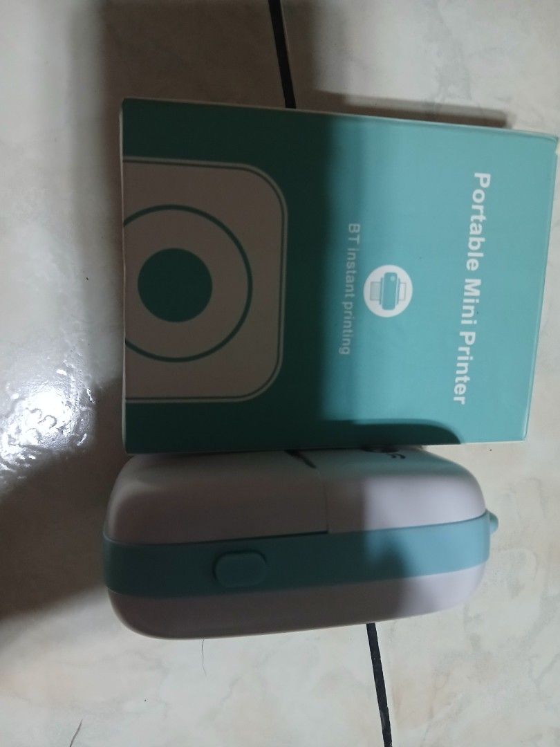 Portable Mini Printer - BT Instant Printing (Category: Printers, Scanners & Copiers) located in Valenzuela. Submitted by thinztin (Listing ID 1432772974, Image 1). Description: - Portable mini printer - BT instant printing - Sleek white and teal design - Includes original box.