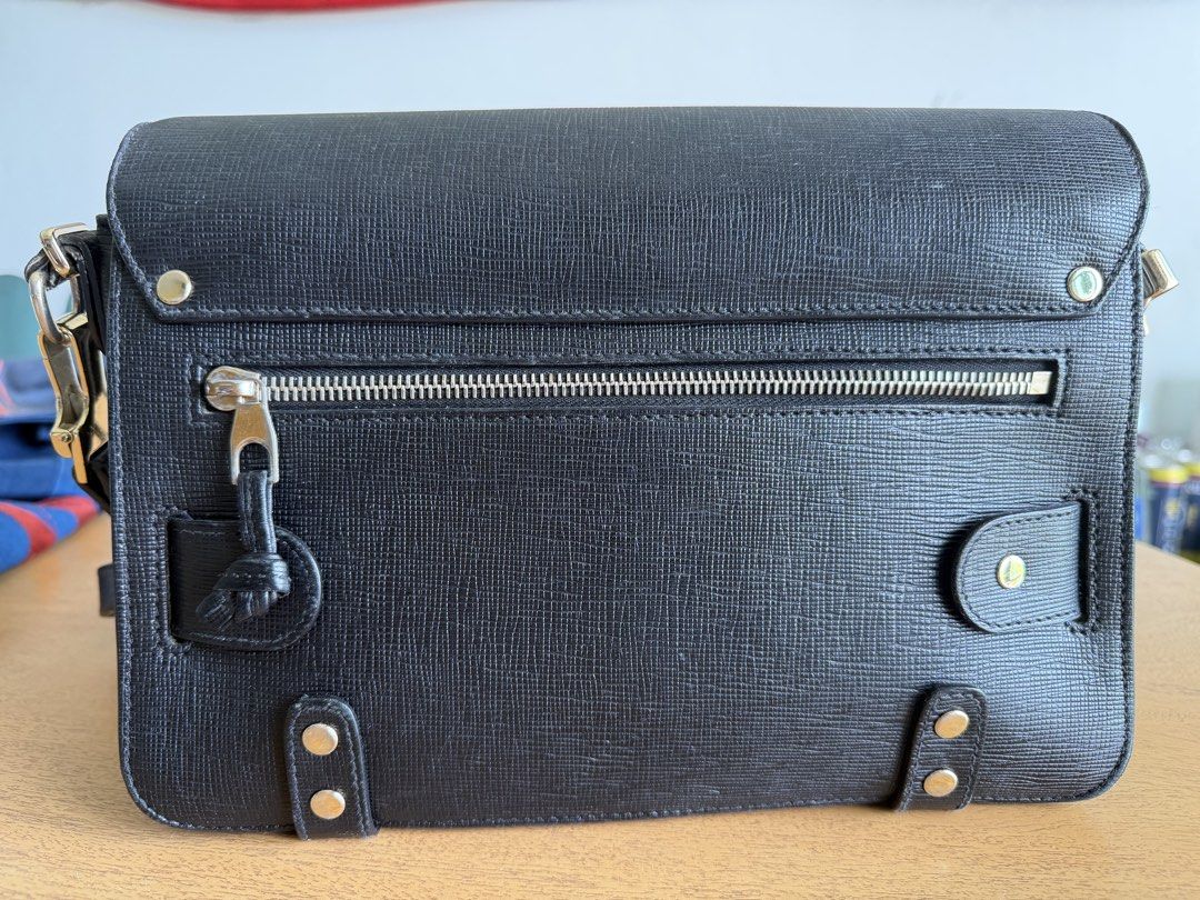 Proenza Schouler PS1 Medium Black Leather Bag (Category: Luxury Bags & Wallets) located in Cebu City. Submitted by miguelgsarmiento (Listing ID 1432623753, Image 2). Description: - Proenza Schouler PS1 Medium bag - Black textured leather - Flap closure with metal clasp - Shoulder strap - Exterior: Zippered back pocket, front pocket under flap - Interior: Zippered pocket - Includes original tags and care card Condition : Some indentations and scuf