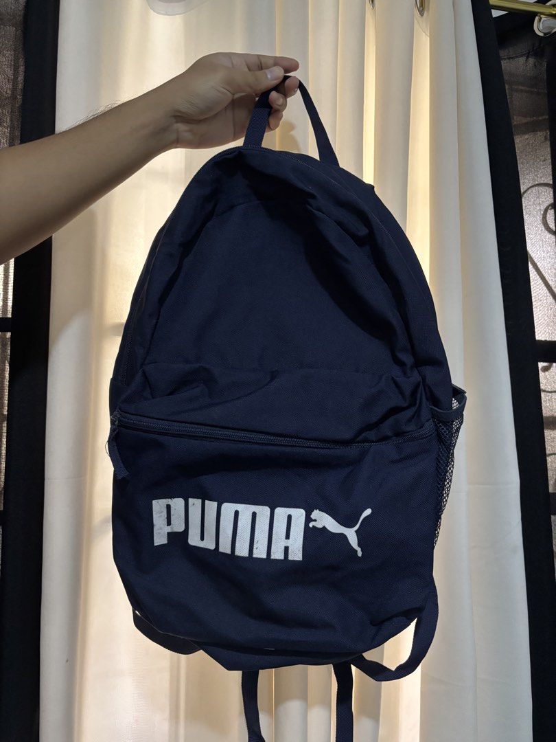 Puma Backpack (Category: Backpacks) located in Manila. Submitted by yannpreloved_ (Listing ID 1432647833, Image 1). Description: Navy blue Puma backpack Loc: Quezon City Rfs: decluttering Issue: stains in Puma print.