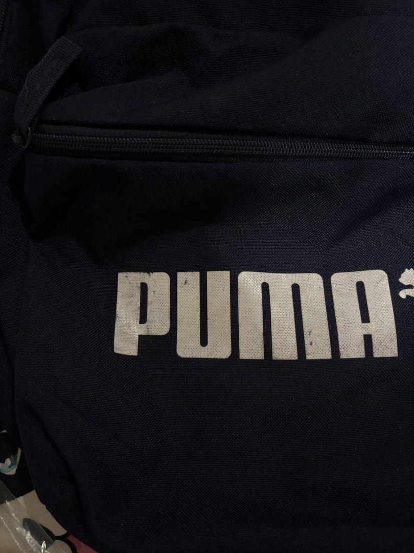 Puma Backpack (Category: Backpacks) located in Manila. Submitted by yannpreloved_ (Listing ID 1432647833, Image 3). Description: Navy blue Puma backpack Loc: Quezon City Rfs: decluttering Issue: stains in Puma print.