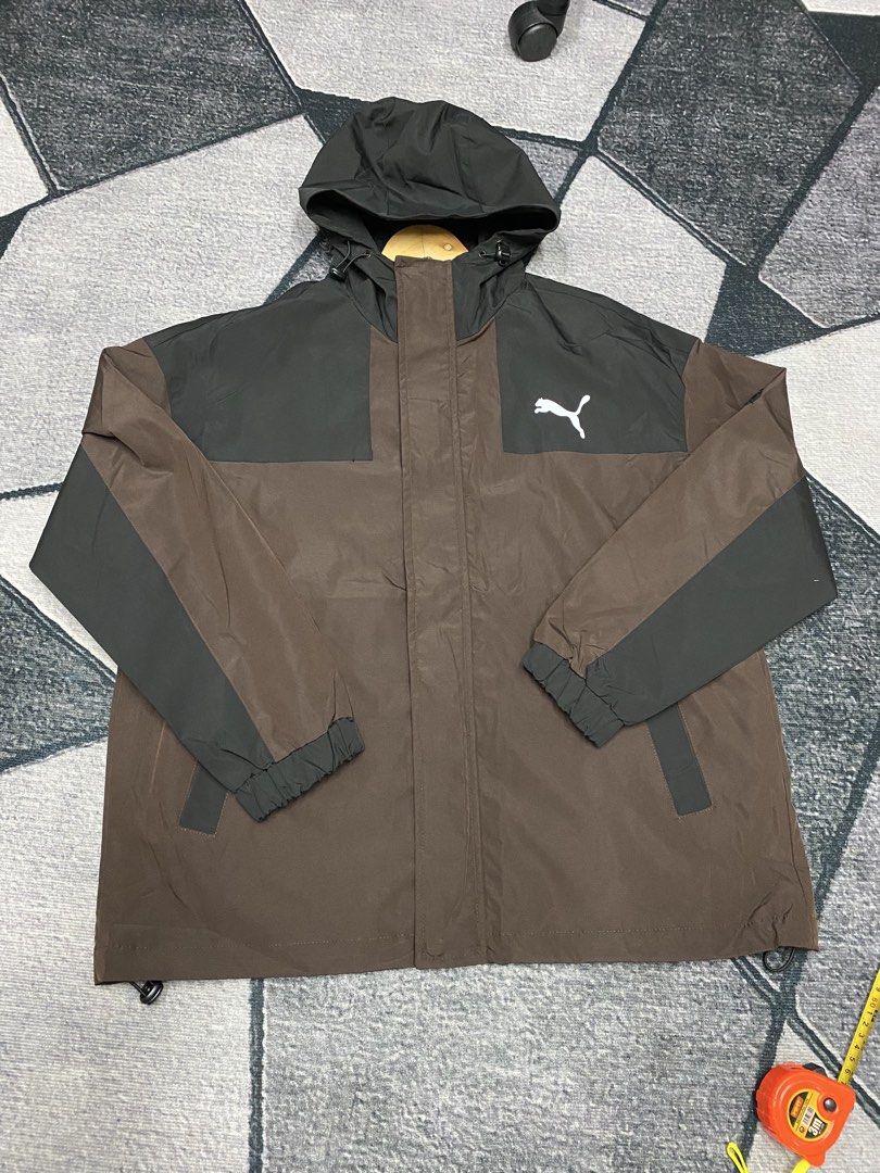 Puma Hooded Jacket - Brown and Black (Category: Coats, Jackets and Outerwear) located in Las Pinas. Submitted by eFF01 (Listing ID 1432698999, Image 1). Description: - Puma hooded jacket - Color: Brown and black - Size: L - Full zip closure - Two front pockets - Hooded - Puma logo on chest and back - Lightweight material - Elastic cuffs - Drawstring hem.