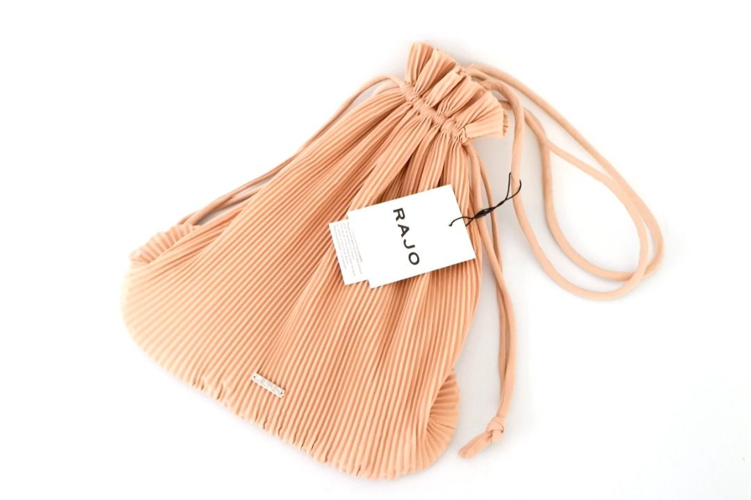 Rajo Laurel | Pleated Drawstring Pouch Bag | Beige (Category: Purses & Pouches) located in San Juan City. Submitted by olispace (Listing ID 1432707003, Image 2). Description: Rajo Laurel | Pleated Drawstring Pouch Bag | Beige 🌷Condition: 10/10 Original Price: ₱1,995 📌Sale Price: ₱1,299 —RFS: Decluttering 🧺 📍Brgy. Balong-bato, San Juan City MOP: Gcash MOD: Lalamove.