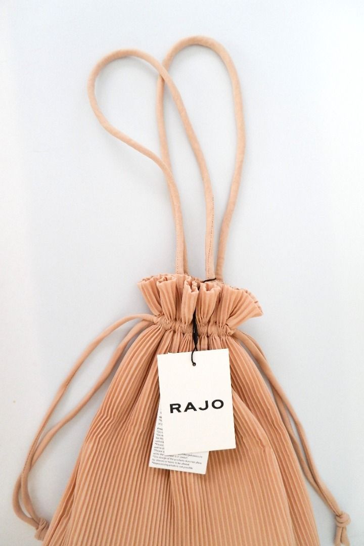 Rajo Laurel | Pleated Drawstring Pouch Bag | Beige (Category: Purses & Pouches) located in San Juan City. Submitted by olispace (Listing ID 1432707003, Image 1). Description: Rajo Laurel | Pleated Drawstring Pouch Bag | Beige 🌷Condition: 10/10 Original Price: ₱1,995 📌Sale Price: ₱1,299 —RFS: Decluttering 🧺 📍Brgy. Balong-bato, San Juan City MOP: Gcash MOD: Lalamove.