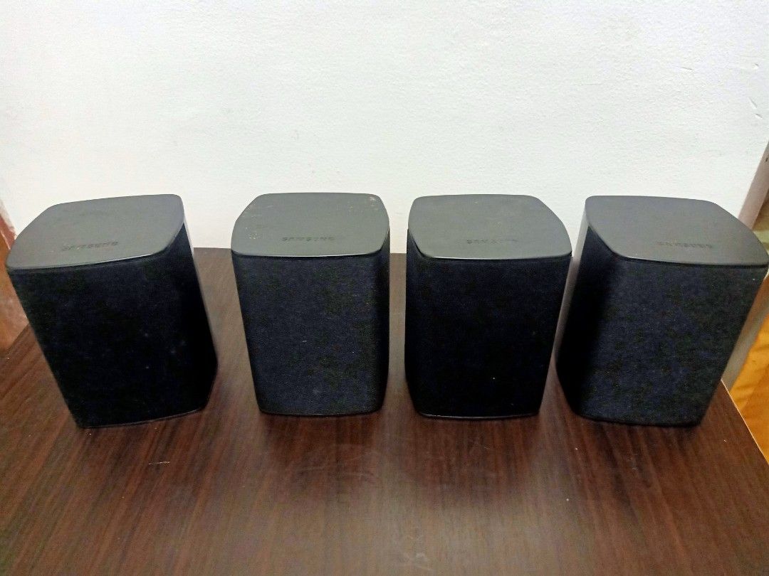 Samsung Surround Sound Speakers 4pcs (Category: Soundbars, Speakers & Amplifiers) located in Las Pinas. Submitted by the_recycle_shop (Listing ID 1432745474, Image 1). Description: - Samsung surround sound speaker set (4 speakers total) - Includes: 2 front speakers, 2 rear speakers - Models: PS-FZ210 and PS-RZ210 - Sleek black finish - Designed for wall mounting - Features speaker terminals for easy connection - Samsung logo present.