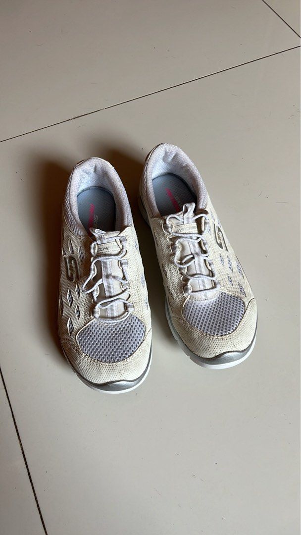 Skechers Memory Foam Sneakers - White (Category: Sneakers) located in Tacloban City. Submitted by priv_ (Listing ID 1432604624, Image 2). Description: - This Skechers sneakers feature a white and gray color scheme. - They have a mesh upper and a memory foam insole for added comfort. - size US 8.5. - The shoes have a lace-up closure and a sporty design, perfect for everyday wear. Mop: Gcash Location: Tacloban City.