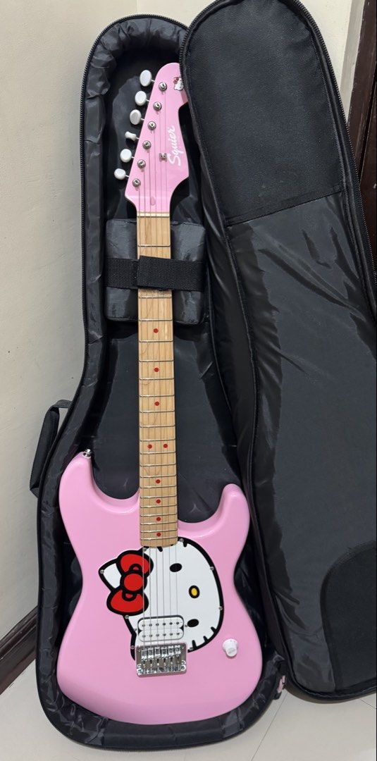 Squier by Fender Hello Kitty Electric Guitar LIMITED EDITION (Category: Musical Instruments) located in Quezon City. Submitted by jeypogi666 (Listing ID 1432752498, Image 1). Description: BARELY USED (ILANG BESES LANG NAGAMIT) payment via gcash/maya/bpi + lalamove/grab or meetup cubao area PRICE IS NEGOTIABLE RFS: di na nagagamit.