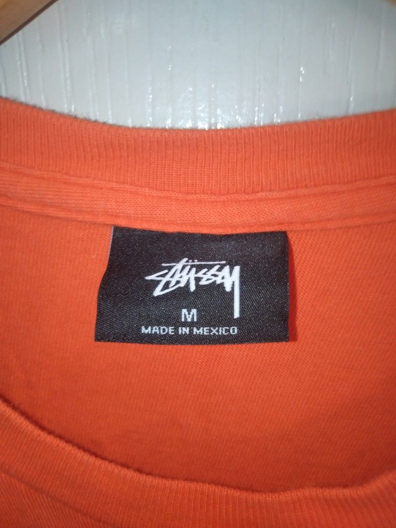 Stussy Orange T-shirt (Category: Tshirts & Polo Shirts ) located in Manila. Submitted by jaradhiggins24 (Listing ID 1432743141, Image 3). Description: - Stussy orange t-shirt - Size: M - Features the iconic Stussy logo - Made in Mexico - Material: 100% cotton - Care instructions: Machine wash cold, tumble dry low, do not bleach, do not iron.