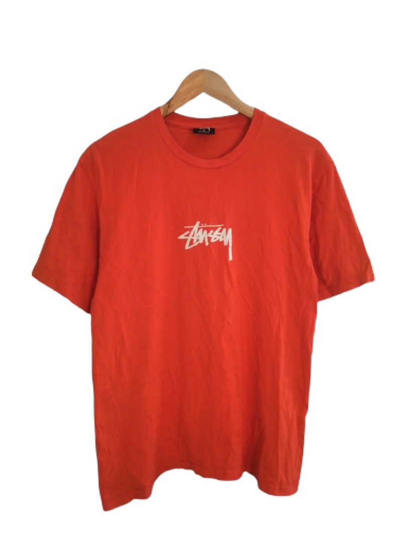 Stussy Orange T-shirt (Category: Tshirts & Polo Shirts ) located in Manila. Submitted by jaradhiggins24 (Listing ID 1432743141, Image 1). Description: - Stussy orange t-shirt - Size: M - Features the iconic Stussy logo - Made in Mexico - Material: 100% cotton - Care instructions: Machine wash cold, tumble dry low, do not bleach, do not iron.