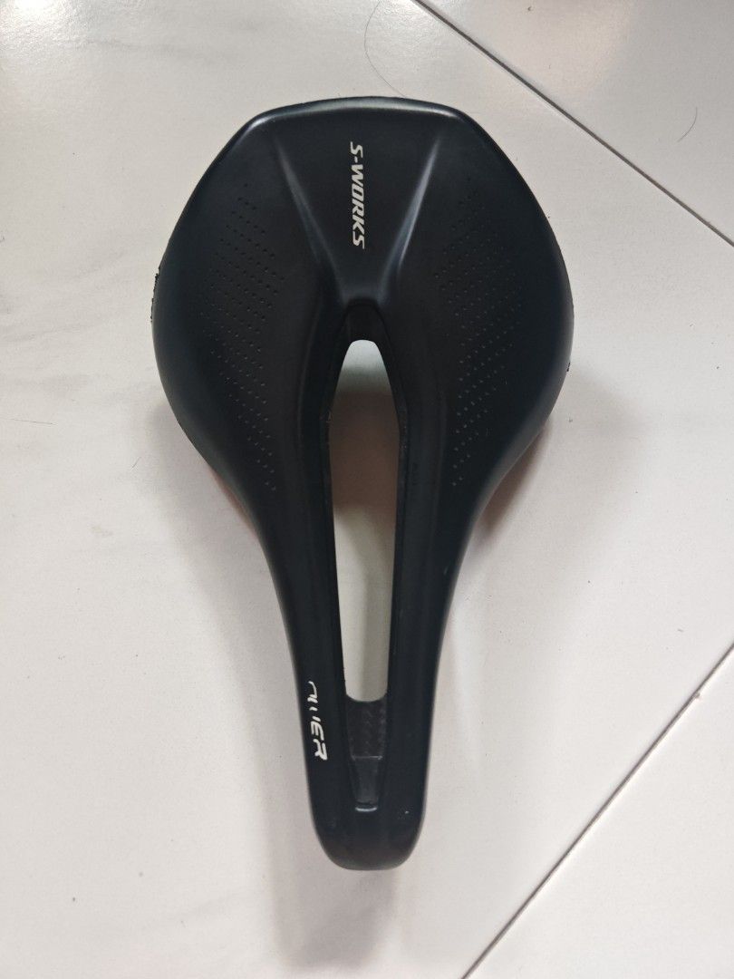 Specialized Sworks Power Carbon Saddle 143mm (Category: Parts & Accessories) located in Singapore. Submitted by thebusuncle (Listing ID 1432686151, Image 2). Description: Specialized S-Works Power saddle with SWAT mount holes 143mm width, 240mm length. Weigh 159g Features a carbon fiber base , carbon rails and a sleek black design. The saddle has some minor signs of wear, as shown in the photos..