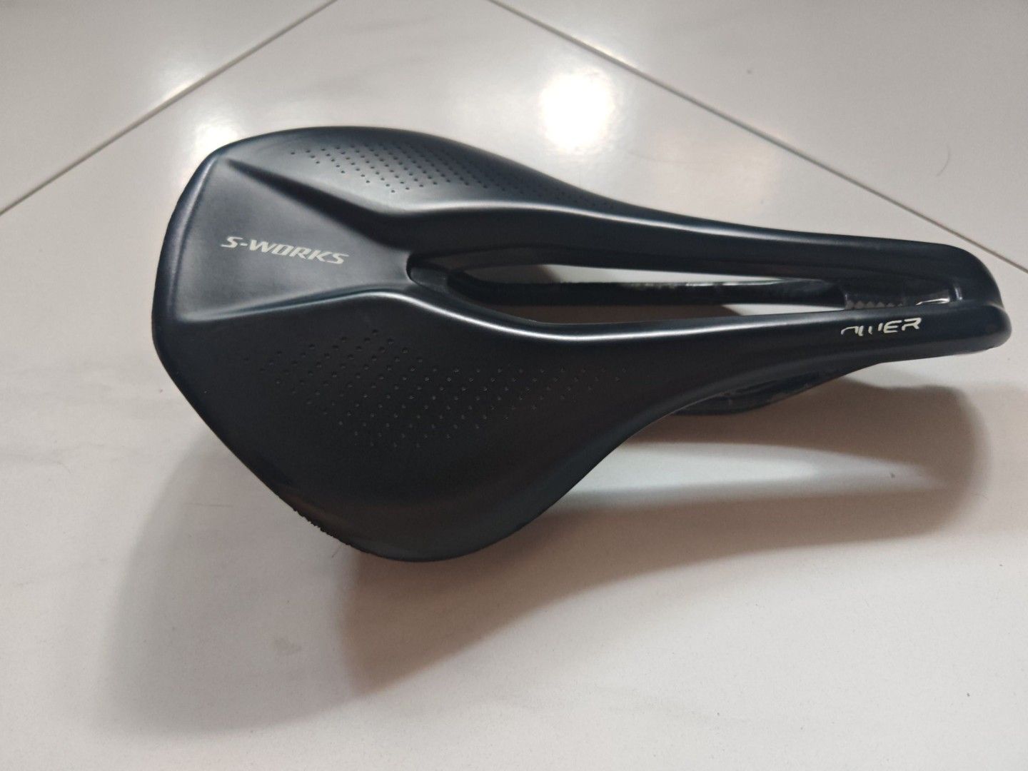 Specialized Sworks Power Carbon Saddle 143mm (Category: Parts & Accessories) located in Singapore. Submitted by thebusuncle (Listing ID 1432686151, Image 3). Description: Specialized S-Works Power saddle with SWAT mount holes 143mm width, 240mm length. Weigh 159g Features a carbon fiber base , carbon rails and a sleek black design. The saddle has some minor signs of wear, as shown in the photos..