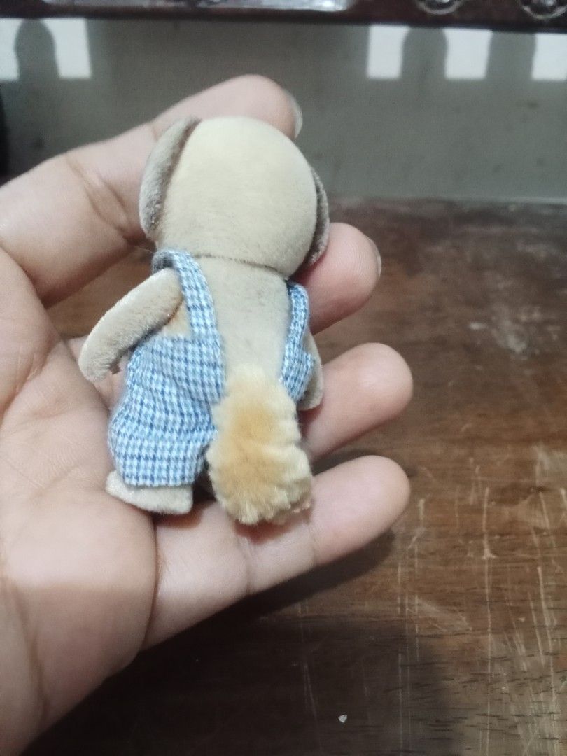 Sylvanian Families Dog Figure (Category: Figurines & Statues) located in Bocaue. Submitted by marajapansurplus (Listing ID 1432601510, Image 2). Description: - Adorable Sylvanian Families dog figure - Features blue overalls with red buttons - Light brown body with darker brown ears - Fluffy tail - Small and well-made - Perfect for collectors or play.
