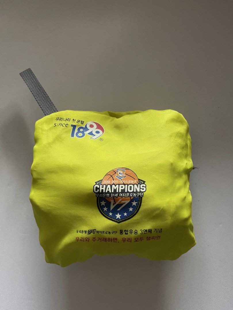 The North Face Packable Shopping Bag Eco Bag (Category: Tote Bags) located in Cavite. Submitted by abellu (Listing ID 1432634136, Image 3). Description: - The North Face shopping bag - Bright yellow color - Folds into a compact pouch - Gray zipper closure - Features a small red brand tag - Includes a carrying loop - Displays brand logo and graphic when unfolded.