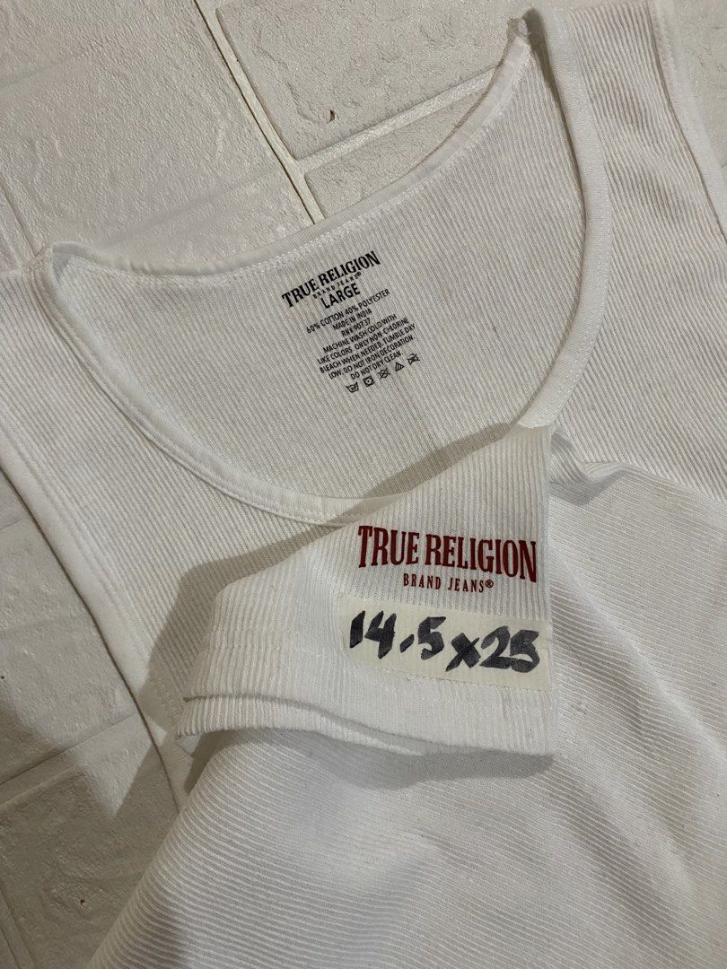 True Religion Sleeveless Tank Top (Category: Sleeveless) located in Tagbilaran City. Submitted by we_thrift (Listing ID 1432739985, Image 2). Description: Stretchable Fabric Large on tag Width:14.5 Length:25.