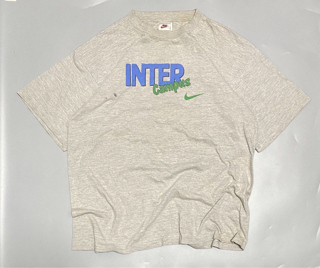 Vintage Nike Inter Campus T-shirt - Large (Category: Tshirts & Polo Shirts ) located in Manila. Submitted by owabaet12 (Listing ID 1432711065, Image 1). Description: - Vintage Nike Inter Campus T-shirt - Grey base color - Features blue and green "INTER Campus" print - Nike logo on front and back - Made in Hungary - Size: Large.