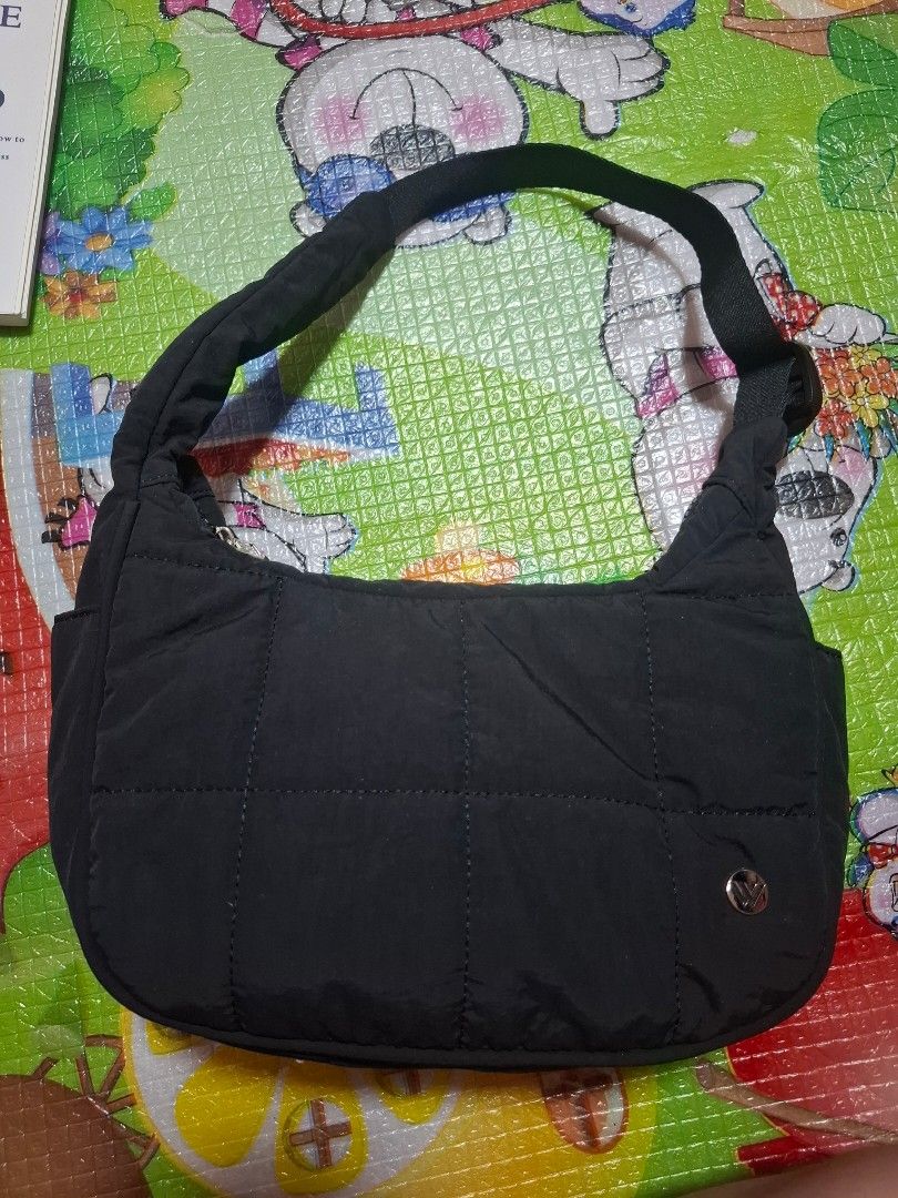 WESTBRONCO Black Quilted Shoulder Bag (Category: Shoulder Bags) located in Manila. Submitted by biabits (Listing ID 1432635117, Image 2). Description: - Black quilted shoulder bag - Single shoulder strap - Snap closure - Smooth, possibly nylon-like material - Ideal for everyday use - Spacious .