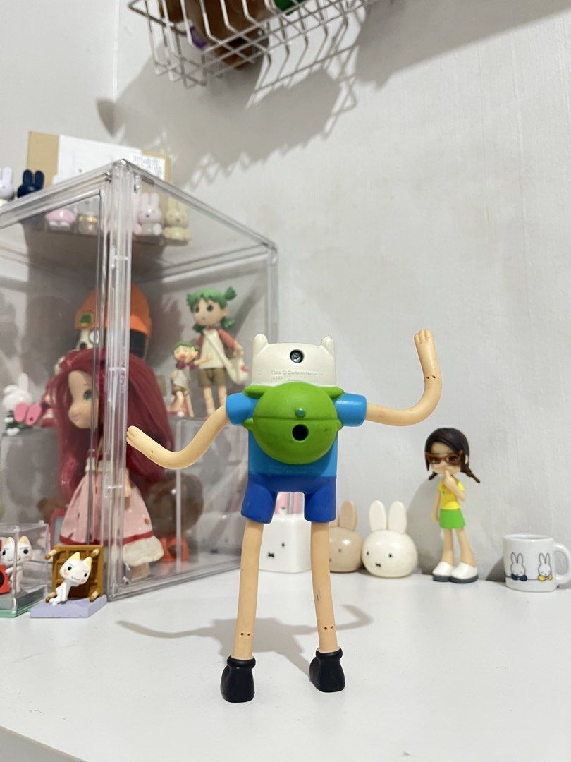 Adventure Time Finn Figure (Category: Figurines & Statues) located in San Antonio. Submitted by butter.miff (Listing ID 1432933846, Image 2). Description: - Adventure Time Finn figure - Features Finn's iconic blue shirt, shorts, and white hat - Articulated arms and legs - Includes Cartoon Network logo - Marked "Made for McDonald's" on the back.