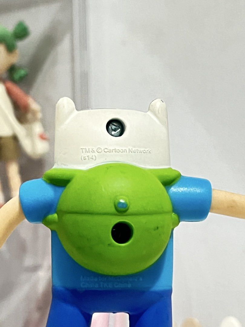 Adventure Time Finn Figure (Category: Figurines & Statues) located in San Antonio. Submitted by butter.miff (Listing ID 1432933846, Image 3). Description: - Adventure Time Finn figure - Features Finn's iconic blue shirt, shorts, and white hat - Articulated arms and legs - Includes Cartoon Network logo - Marked "Made for McDonald's" on the back.