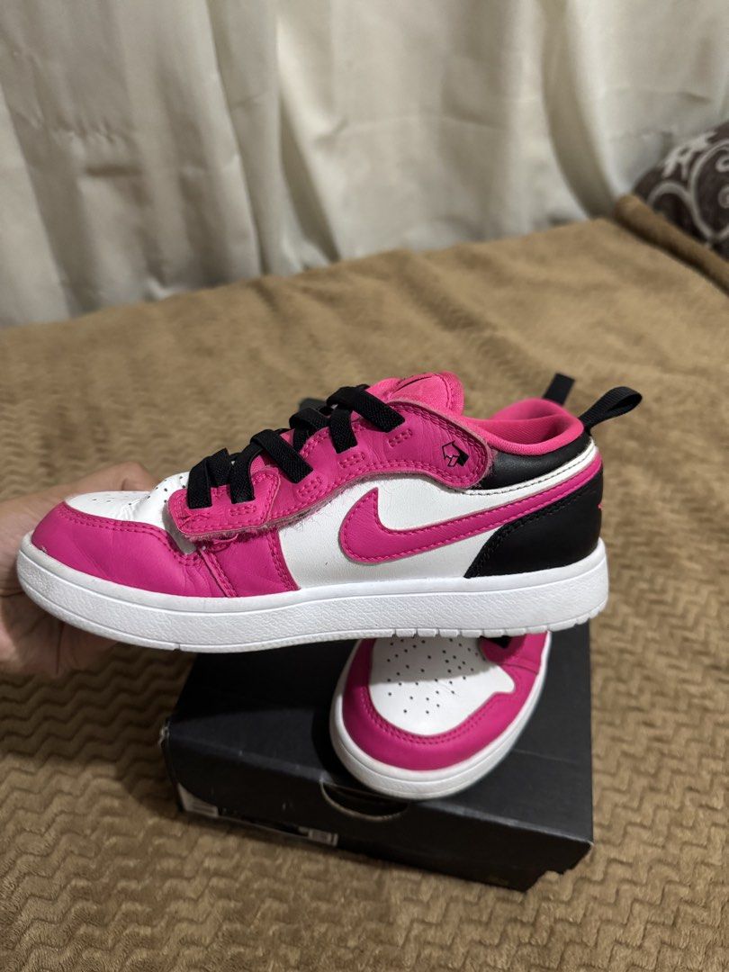 Air Jordan 1 Low ALT (PS) Pink (Category: Babies & Kids Fashion) located in Bacoor. Submitted by weyrenz (Listing ID 1432892818, Image 2). Description: - Air Jordan 1 Low ALT (PS) sneakers - Color: Pink, White, and Black - Iconic Nike swoosh and Air Jordan logo - Includes original box - Black laces - Heel pull tab - White sole Still in a very good condition. May crease lang due to usage but no other issues. Size 20.5 cm. The box is still here. Th