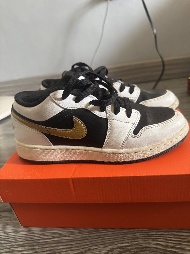Air Jordan 1 Low Black Gold (Category: Babies & Kids Fashion) located in Las Pinas. Submitted by freeeezt (Listing ID 1432849391, Image 1). Description: - Air Jordan 1 Low sneakers - Colorway: Black, white, and gold - Features Air Jordan logo - Black laces and tongue - Size: US 4.5Y - Comes with original box.