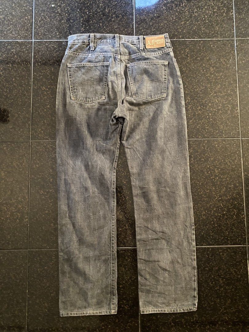 Armani Jeans - Grey Denim Jeans (Category: Jeans) located in Calapan. Submitted by yowstuff (Listing ID 1432993747, Image 2). Description: - Armani Jeans denim pants in grey - Classic five-pocket design - Button closure - Straight leg cut - Armani Jeans leather logo patch at the back - Size tag visible.