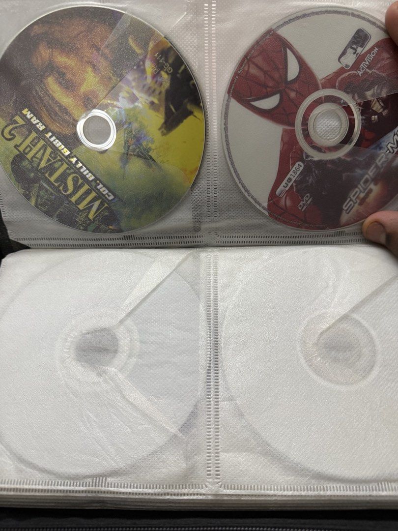 Assorted PS2, Wii, and DVD Games (Category: PlayStation) located in Manila. Submitted by kennethpam82250 (Listing ID 1432960019, Image 1). Description: - Collection of PS2, Wii, and DVD video games. - Includes titles such as: - Mistahz 2 - Spider-Man - NBA 2K11 - Naruto Ultimate Ninja - G-Force - Wii Play Motion - Perfect Horror 2 - Discs are stored in a CD binder. - Please message to check availability of individual games. Tell me your price.