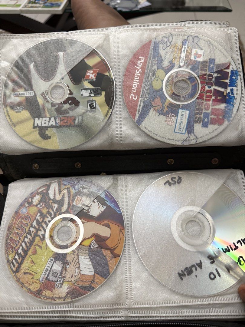 Assorted PS2, Wii, and DVD Games (Category: PlayStation) located in Manila. Submitted by kennethpam82250 (Listing ID 1432960019, Image 2). Description: - Collection of PS2, Wii, and DVD video games. - Includes titles such as: - Mistahz 2 - Spider-Man - NBA 2K11 - Naruto Ultimate Ninja - G-Force - Wii Play Motion - Perfect Horror 2 - Discs are stored in a CD binder. - Please message to check availability of individual games. Tell me your price.