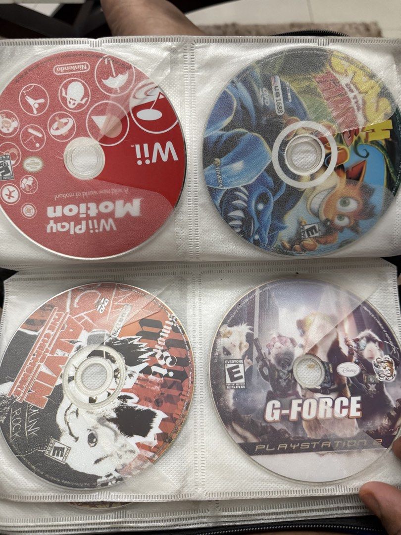 Assorted PS2, Wii, and DVD Games (Category: PlayStation) located in Manila. Submitted by kennethpam82250 (Listing ID 1432960019, Image 3). Description: - Collection of PS2, Wii, and DVD video games. - Includes titles such as: - Mistahz 2 - Spider-Man - NBA 2K11 - Naruto Ultimate Ninja - G-Force - Wii Play Motion - Perfect Horror 2 - Discs are stored in a CD binder. - Please message to check availability of individual games. Tell me your price.