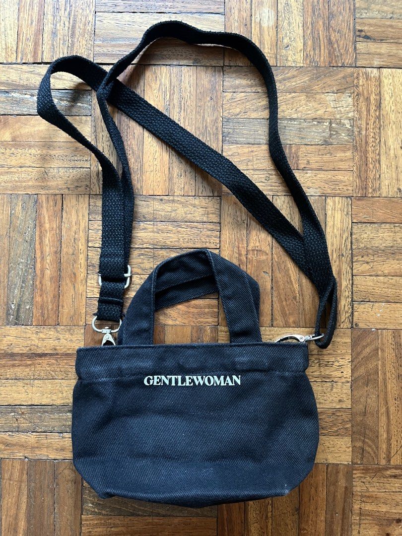 Authentic Gentlewoman Black Tote Bag (Category: Tote Bags) located in Makati City. Submitted by yoursecondbest (Listing ID 1432848230, Image 2). Description: - Gentlewoman black tote bag - Detachable and adjustable shoulder strap - Top handle - Snap closure - White Gentlewoman logo on front - Small size, ideal for essentials - Black interior.