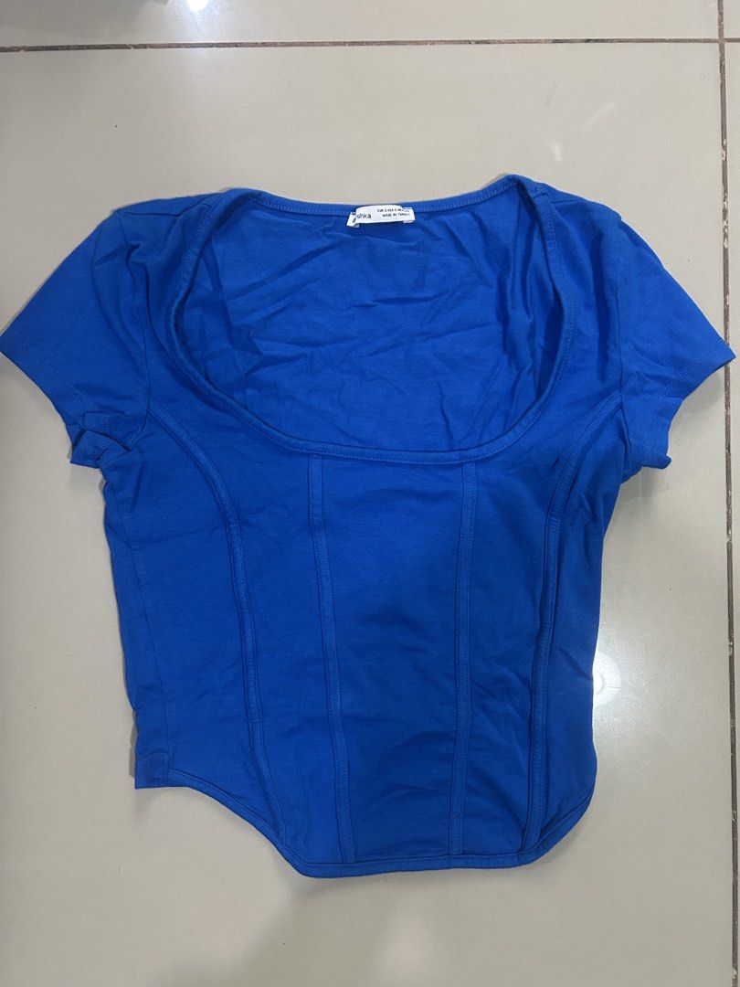 Bershka Blue Corset Top (Category: Shirts) located in Manila. Submitted by k0lab3ar (Listing ID 1432959397, Image 1). Description: - Corset-style design, but no structure - Scoop neckline - Used twice.