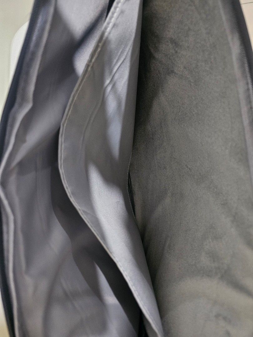 Black Laptop Sleeve with Handle (Category: Laptop Bags & Sleeves) located in Marilao. Submitted by ____jnsk (Listing ID 1432974310, Image 3). Description: - Black laptop sleeve - Features a handle for easy carrying - Multiple pockets for storage - Zipper closure for security - Silver logo detail - Interior lined with light grey fabric - Protects laptop from scratches and minor impacts.