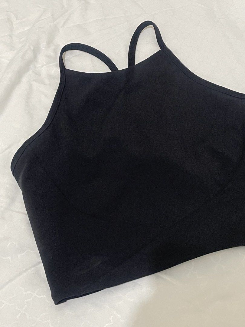 Black Sports Bra (Category: Activewear) located in Las Pinas. Submitted by serialthrifter (Listing ID 1432957637, Image 2). Description: - Black sports bra - Halter neckline - Racerback design - Made of smooth, stretchy material - Cropped style - Comfortable fit - Minimalist design - Versatile for different outfits.