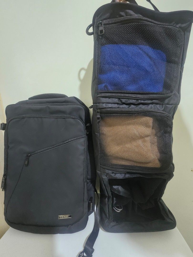 Black Travel Backpack with Organizer, Vacuum Bag + Pump (Category: Backpacks) located in Marilao. Submitted by ____jnsk (Listing ID 1432972198, Image 1). Description: - Black travel backpack - Multiple compartments for organized packing - Zippered pockets and mesh dividers - Interior straps to secure belongings - Padded compartment - Handle and shoulder strap - Copenhagen design.