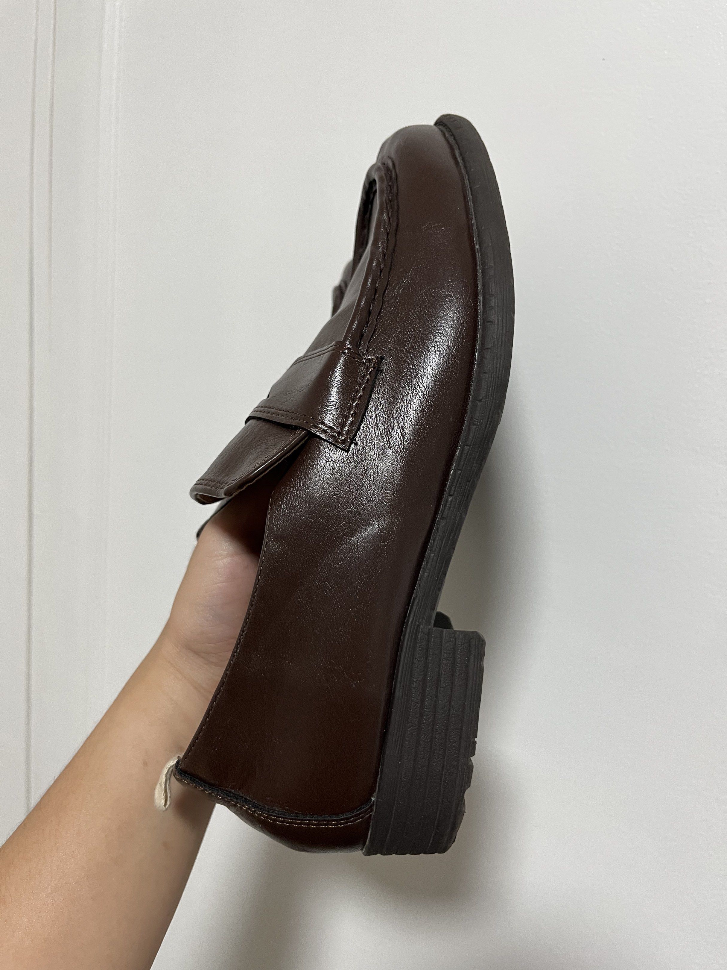 Brown Leather Loafers (Category: Loafers) located in Manila. Submitted by kat_declutter (Listing ID 1432808291, Image 3). Description: - Brown (still shiny) leather loafers - Classic penny strap design - Sturdy sole - Comfortable interior - Well-maintained condition - Signs of wear on soles - Versatile for casual and semi-formal wear.