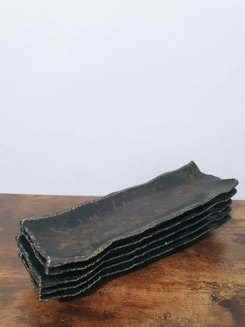 Brutalist Style Sushi Serving Plates (Category: Dinnerware & Cutlery) located in Pasay City. Submitted by thepickypicker (Listing ID 1432797274, Image 2). Description: Brutalist Style Sushi Serving Plate Metallic glazed pottery p 380 each 4 available Size: 13" long, 4 ¼ wide.