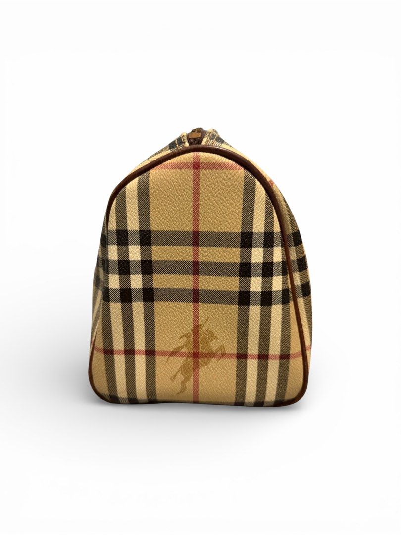 Burberry Handbag and Wallet Set (Category: Luxury Bags & Wallets) located in Taguig. Submitted by seventhstreet_corner (Listing ID 1432904250, Image 2). Description: This is a vintage Burberry Boston bag the classic Haymarket check pattern with leather trim. Binili ko when i travel to japan sa thift shop all original will sell for 13k bag with wallet .