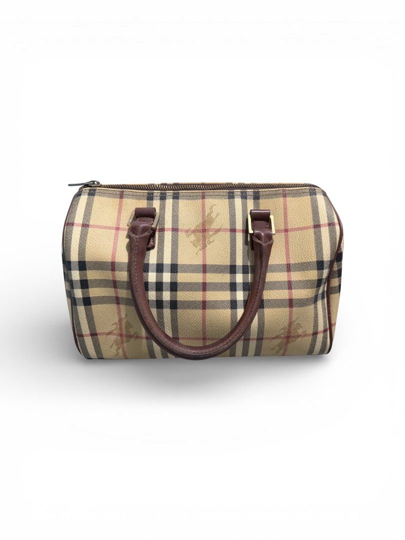 Burberry Handbag and Wallet Set (Category: Luxury Bags & Wallets) located in Taguig. Submitted by seventhstreet_corner (Listing ID 1432904250, Image 1). Description: This is a vintage Burberry Boston bag the classic Haymarket check pattern with leather trim. Binili ko when i travel to japan sa thift shop all original will sell for 13k bag with wallet .