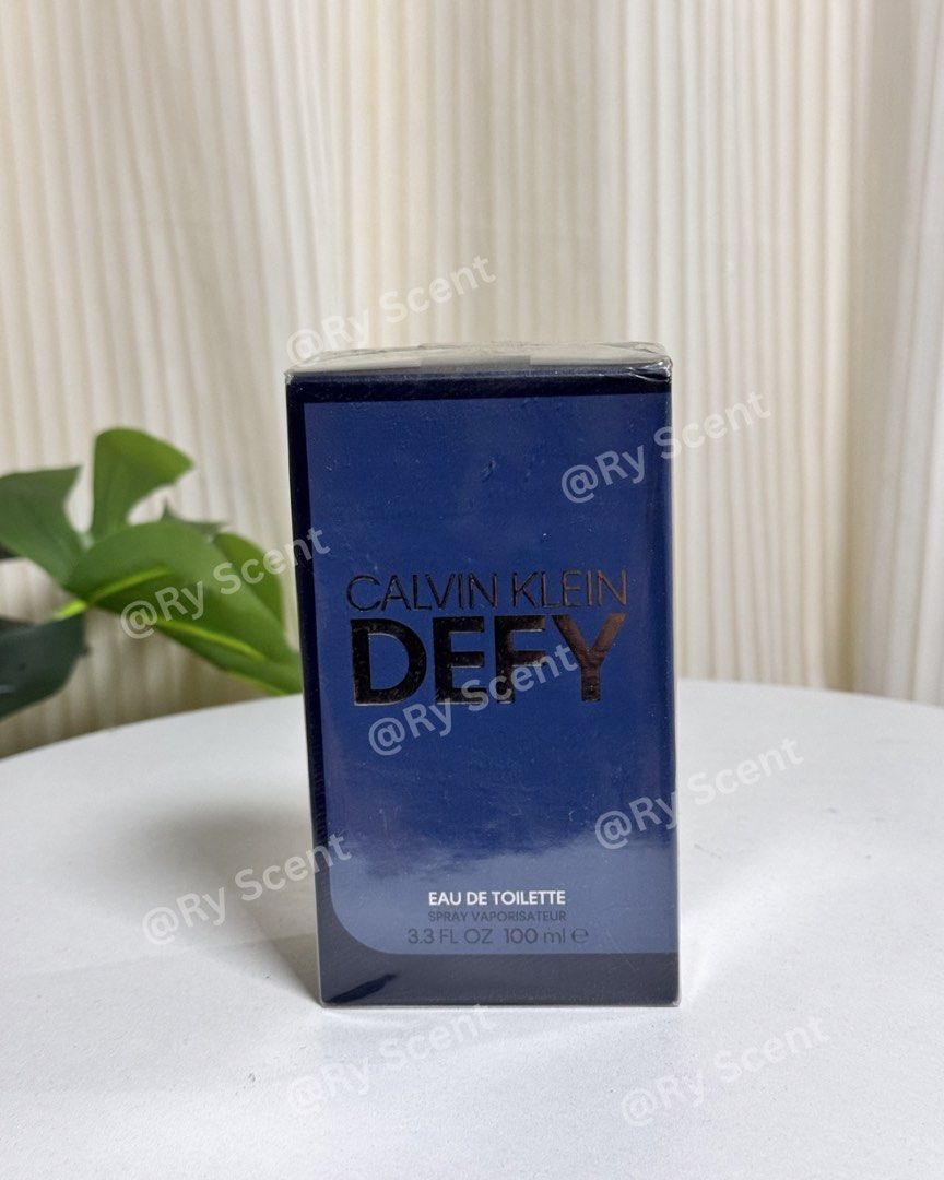 Calvin Klein Defy Eau de Toilette 100ml (Category: Fragrance & Deodorants) located in Dasmarinas. Submitted by ryscentph (Listing ID 1432835839, Image 1). Description: - Calvin Klein Defy Eau de Toilette - 100ml bottle - Dark blue box with gold 'Calvin Klein' and 'Defy' branding - Eau de Toilette spray.