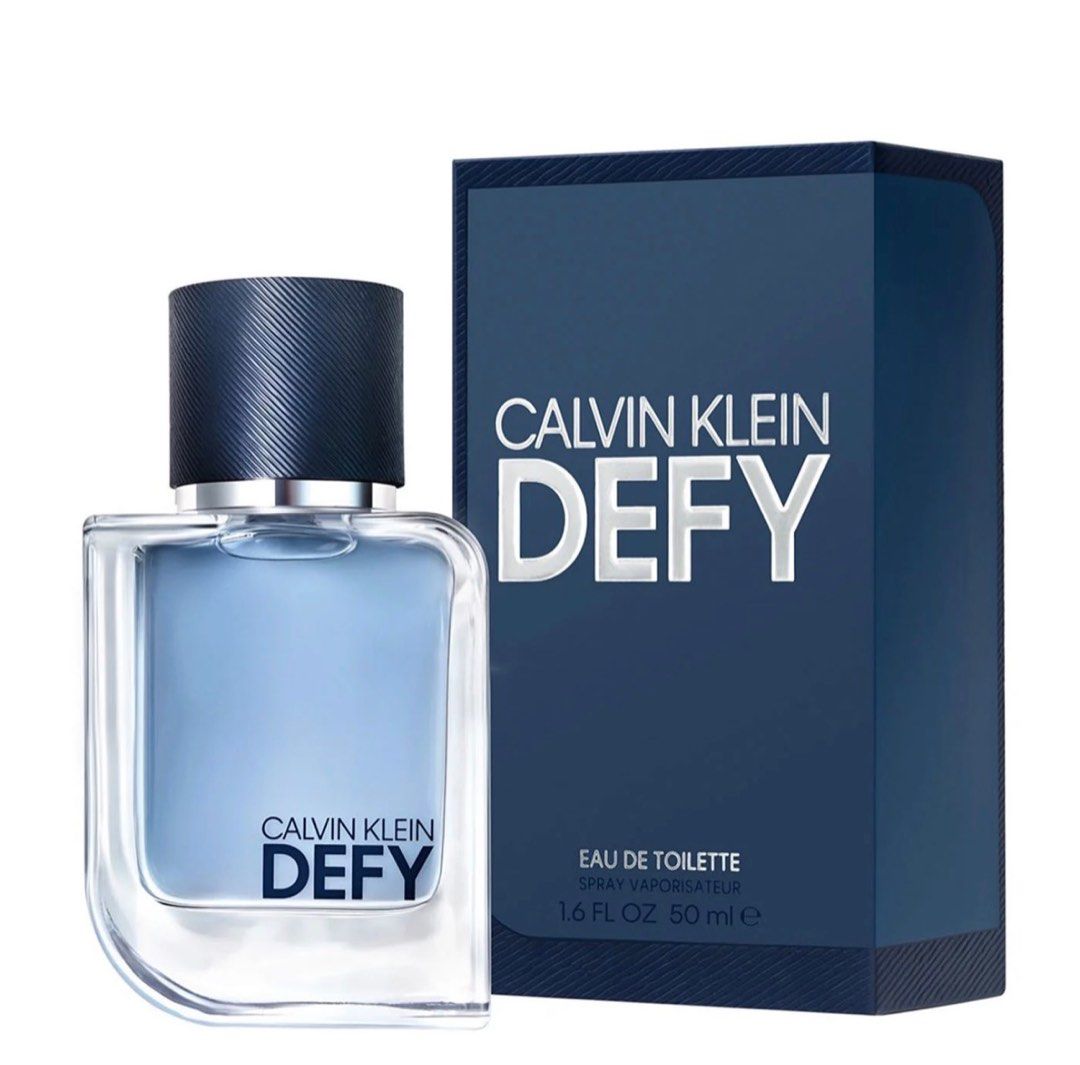 Calvin Klein Defy Eau de Toilette 100ml (Category: Fragrance & Deodorants) located in Dasmarinas. Submitted by ryscentph (Listing ID 1432835839, Image 3). Description: - Calvin Klein Defy Eau de Toilette - 100ml bottle - Dark blue box with gold 'Calvin Klein' and 'Defy' branding - Eau de Toilette spray.