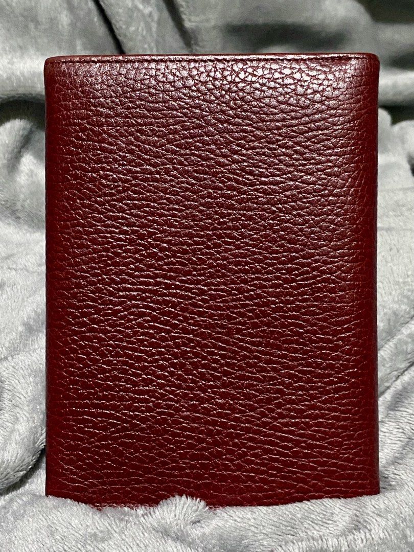 Cartier Must de Cartier Compact Tri-Fold Wallet (Category: Luxury Bags & Wallets) located in Manila. Submitted by byiammargaux (Listing ID 1432928647, Image 3). Description: CARTIER MUST de CARTIER TRIFOLD COMPACT WALLET AUTHENTIC Cartier burgundy leather wallet, the material appears to be high-quality leather, reflecting an elegant and timeless design typical of Cartier products. Crafted from smooth burgundy leather. •Burgundy •Calfskin Leather 