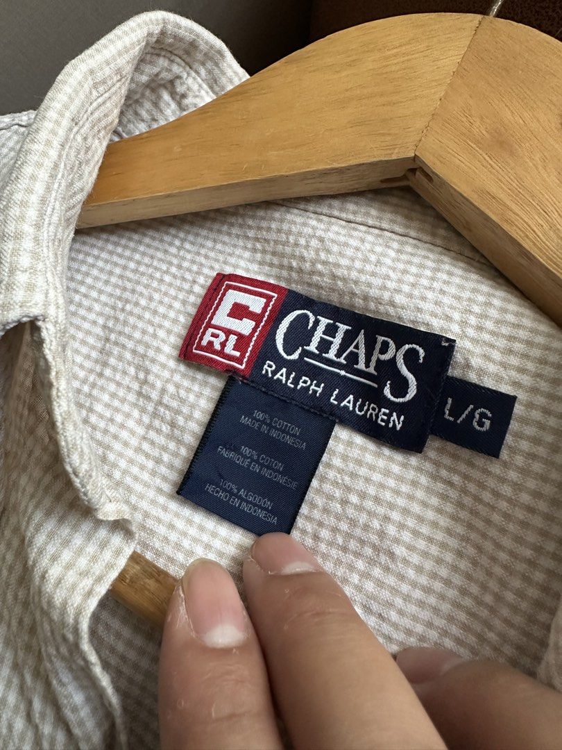 Chaps Ralph Lauren Short Sleeves- Size L (Category: Tshirts & Polo Shirts ) located in Tanza. Submitted by matty199 (Listing ID 1432877808, Image 2). Description: - Chaps Ralph Lauren shirt - Size: L 24x30 inches - Fabric: Textured, light-colored - Style: Button-down with collar - Material: 100% cotton - Condition: Good as new.