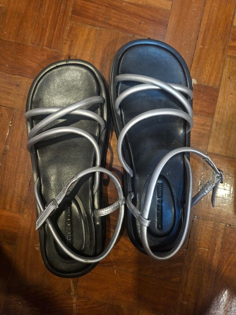 Charles & Keith Silver Open-Toe Strappy Platform Sandals (Size US6) (Category: Sandals) located in Paranaque City. Submitted by dlilly (Listing ID 1432893544, Image 3). Description: The ultimate "cool girl" sandals. Perfect for festivals, brunch dates, or elevating a basic jeans-and-tee look. RFS: Decluttering!.